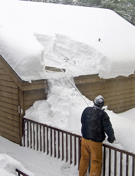 Removing snow from rooftop Snow Removal Service NE | Snow Removal Company